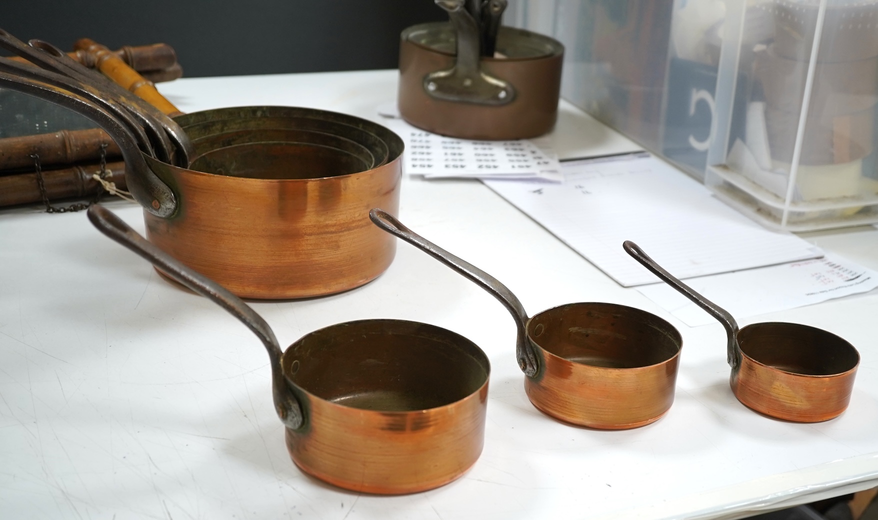 A graduated set of seven French copper pans